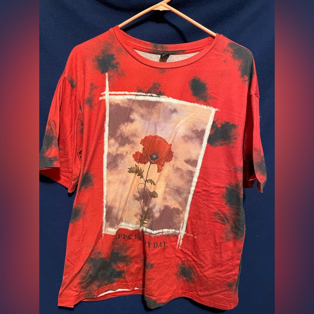 red and black T-shirt it says “happy every day”